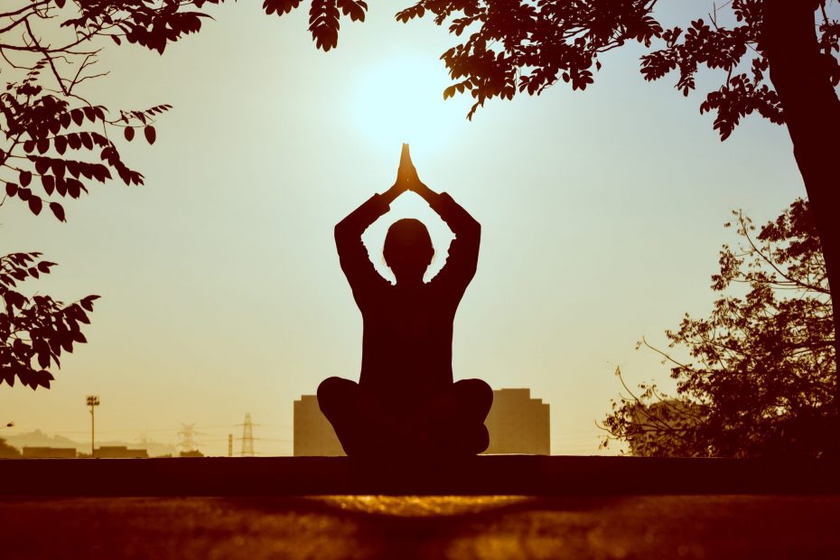 Person doing yoga, practising self-care